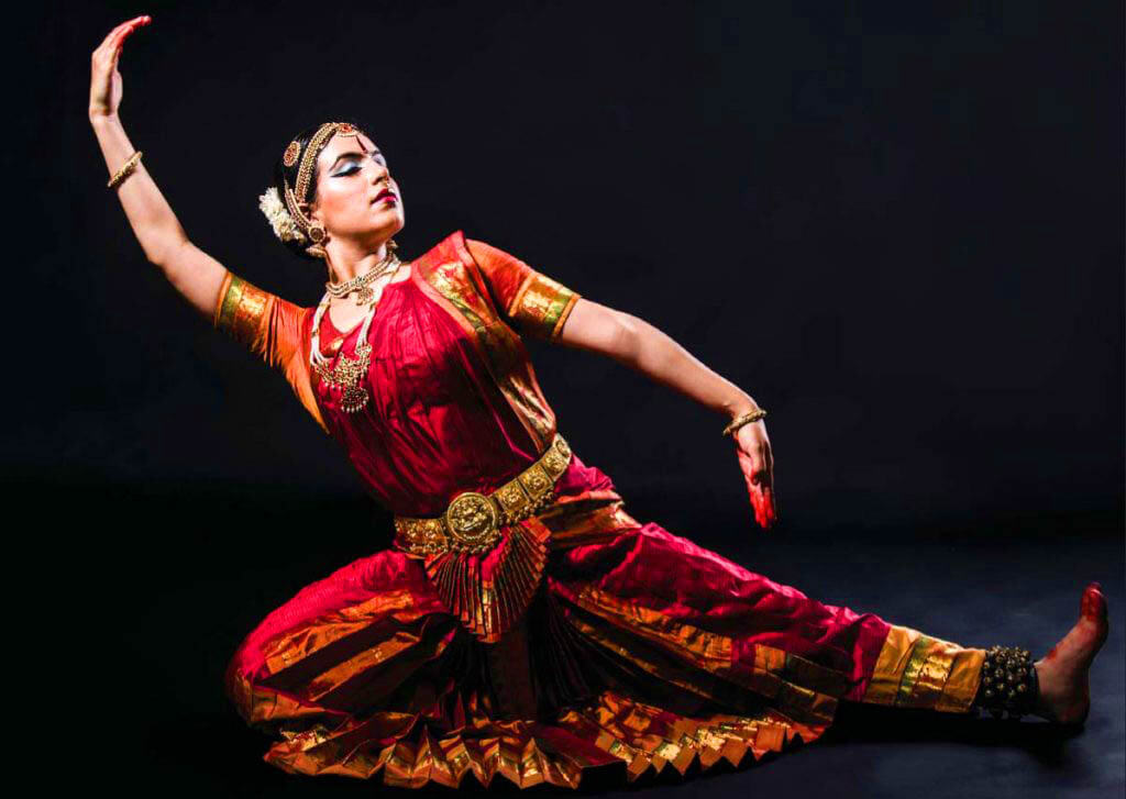 Group of Bharatanatyam dancers in synchronized performance